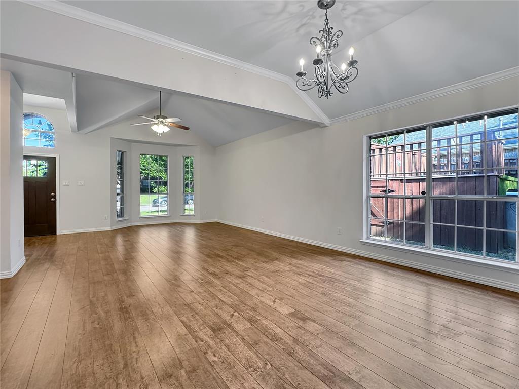 806 Glenwood Court McKinney, TX 75071 - Photo 10 of 29 wooden floor in an empty room with a window
