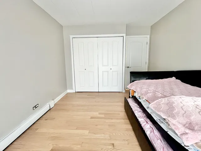 a bedroom with a bed and pillows