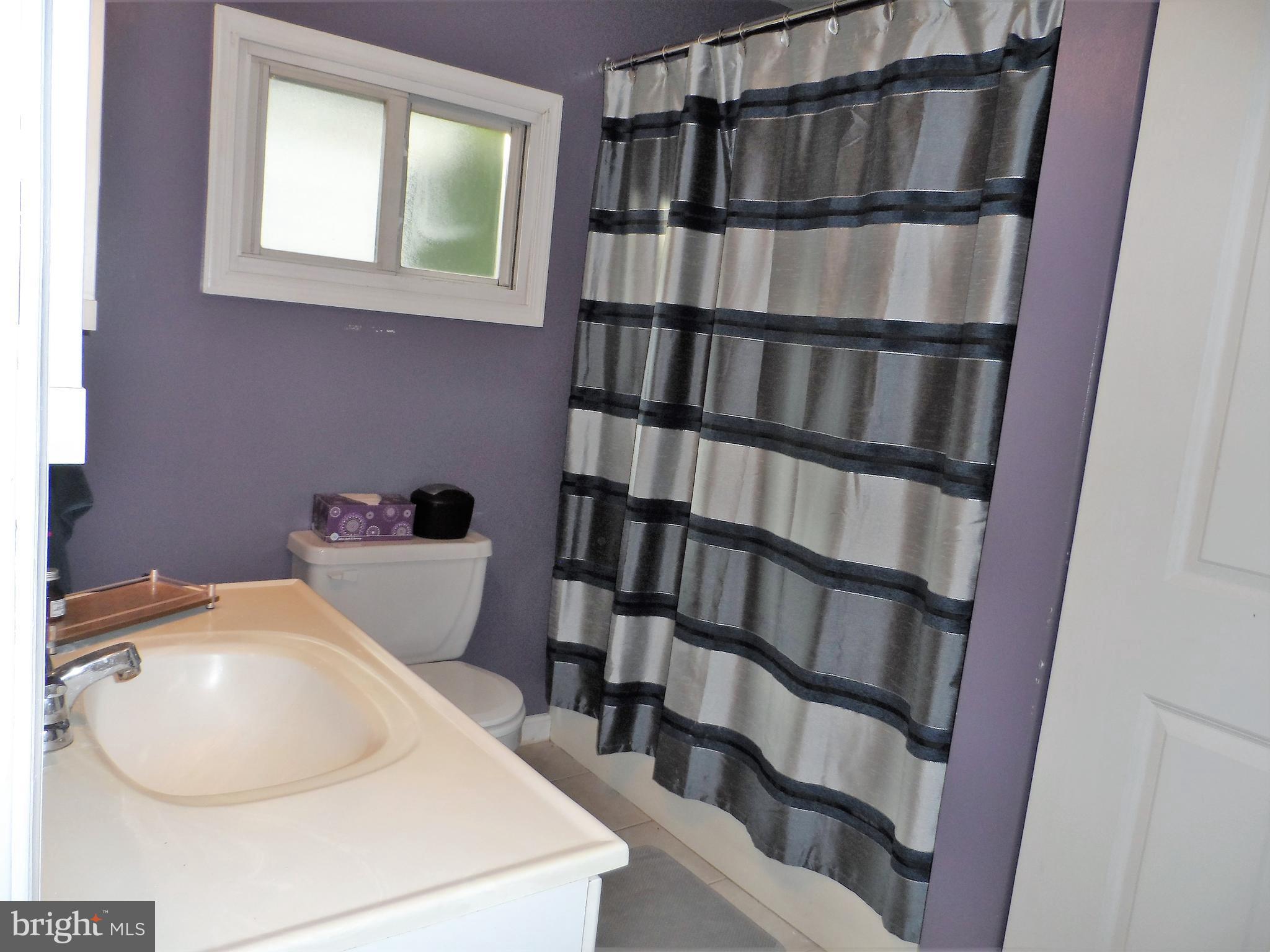 562 Riverside Drive Pasadena, MD 21122 - Photo 16 of 18 2nd Bedroom Full BathBath