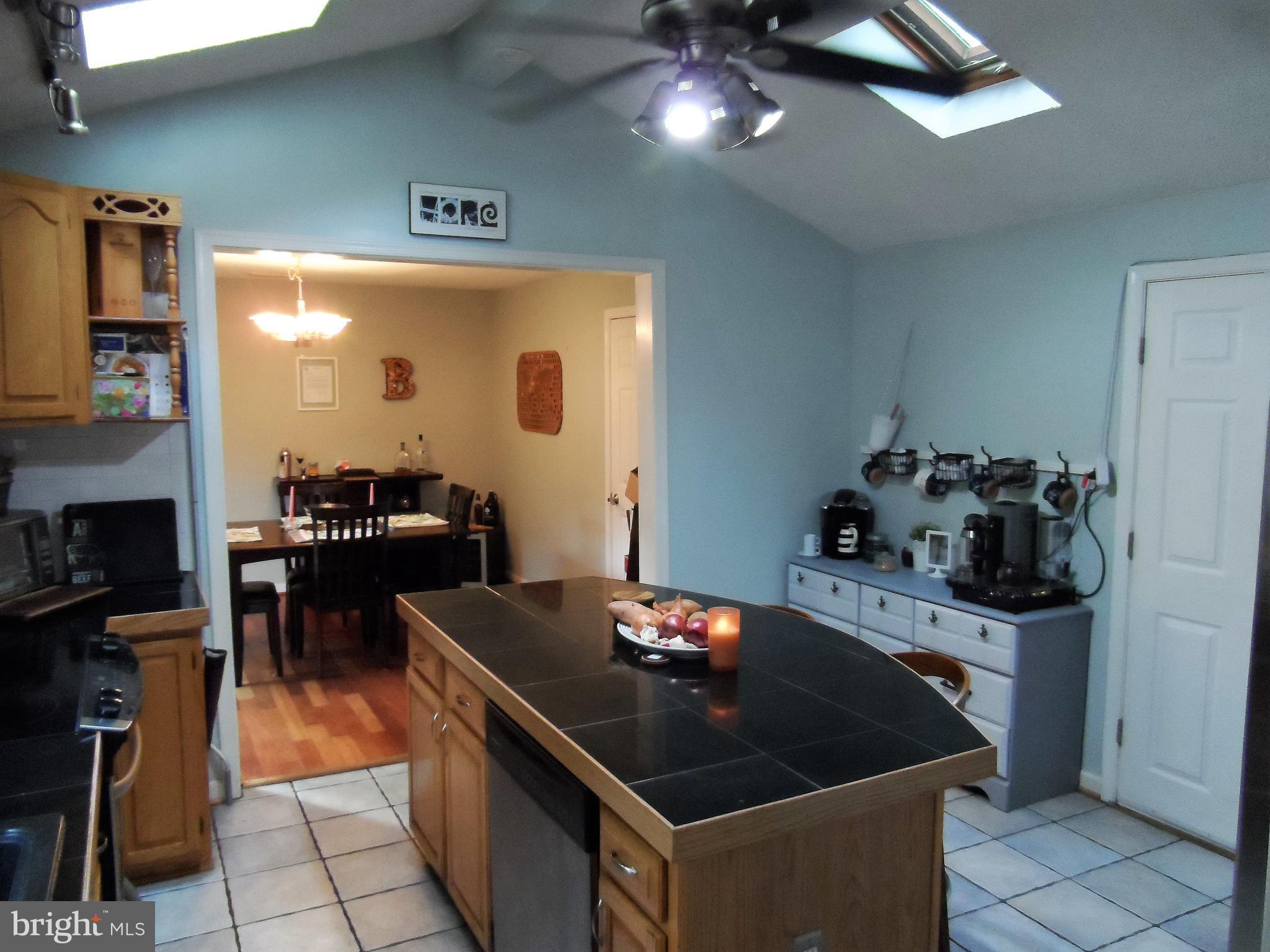 562 Riverside Drive Pasadena, MD 21122 - Photo 8 of 18 Kitchen w/Cathedral Ceilings & Skylights