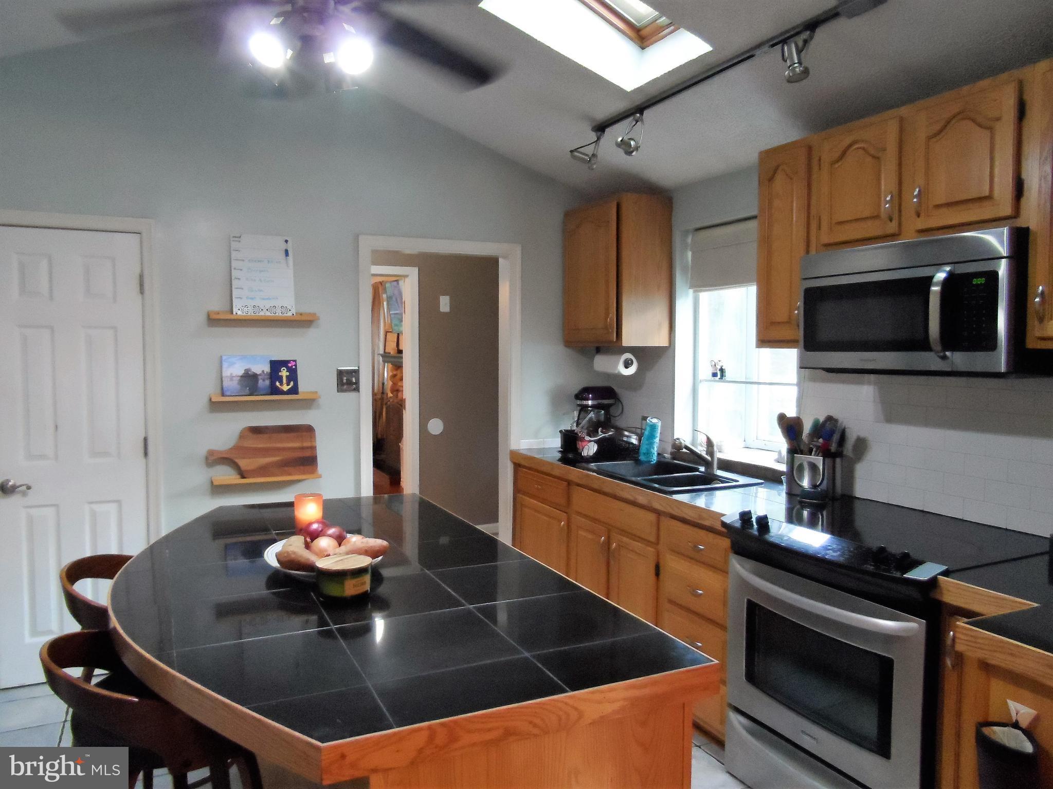 562 Riverside Drive Pasadena, MD 21122 - Photo 9 of 18 Kitchen w/Island & Stainless Appliances