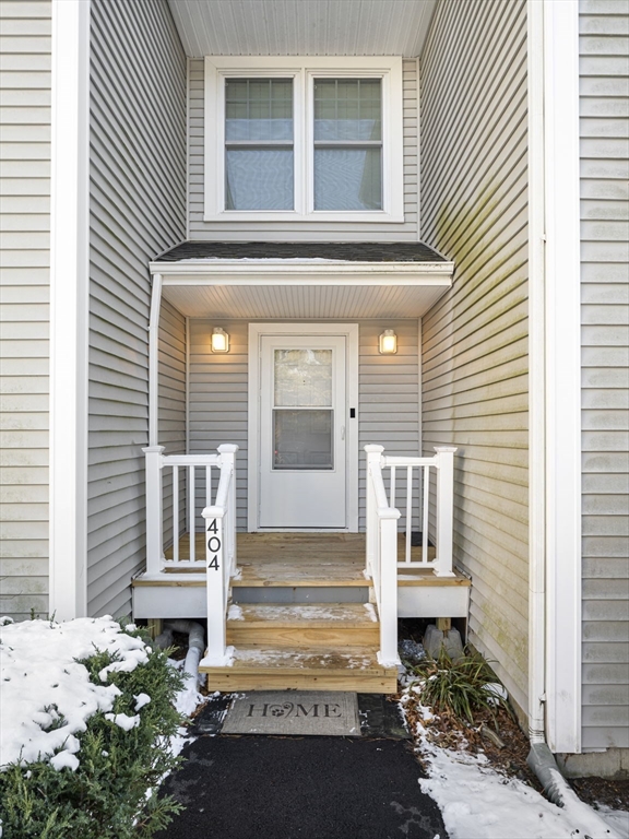 600 County Street, Unit 404 Taunton, MA 02780 - Photo 24 of 26 a front view of a house with a outdoor seating