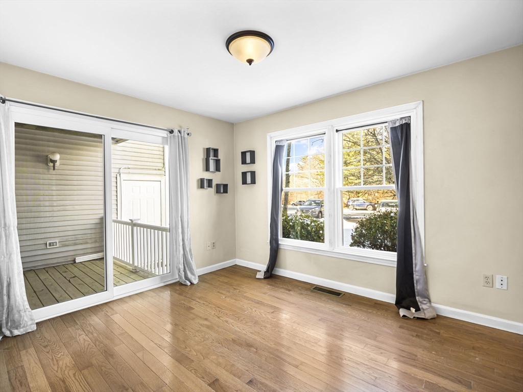 600 County Street, Unit 404 Taunton, MA 02780 - Photo 10 of 26 an empty room with wooden floor and windows
