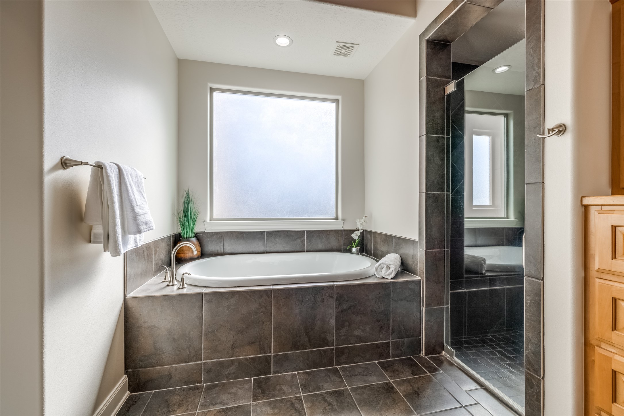 31102 Lower Oxbow Trace Fulshear, TX 77441 - Photo 25 of 50 Enjoy relaxing in the large soaking tub, lots of natural light