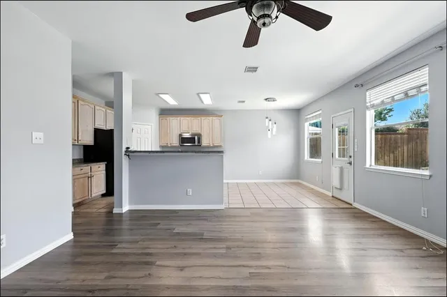 a view of kitchen with cabinets and wooden floor