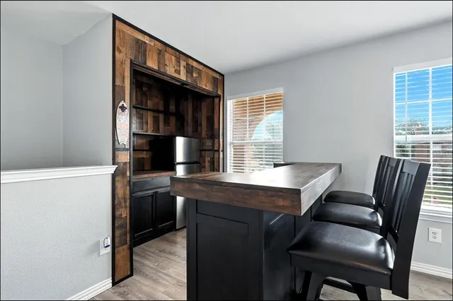 a view of a workspace with furniture