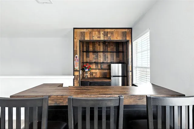 a kitchen with a table and chairs