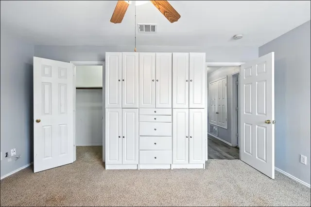 a view of empty room with cabinet