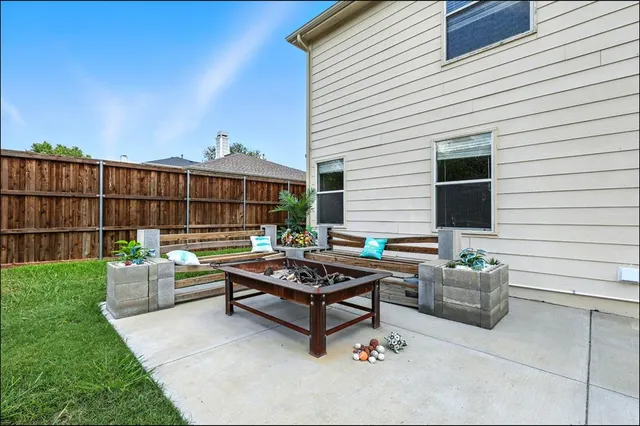 a view of a patio with couches chairs and a fire pit