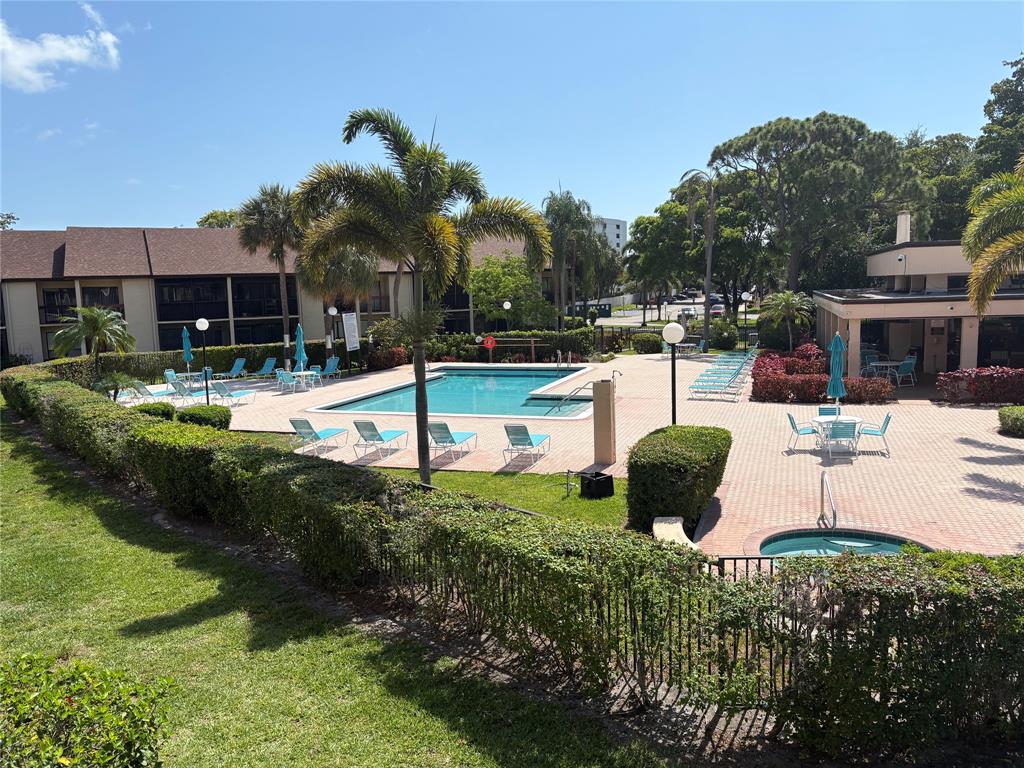 2249 Southwest 15th Street, Unit 185 Deerfield Beach, FL 33442 - Photo 17 of 31 a view of a house with backyard and sitting area