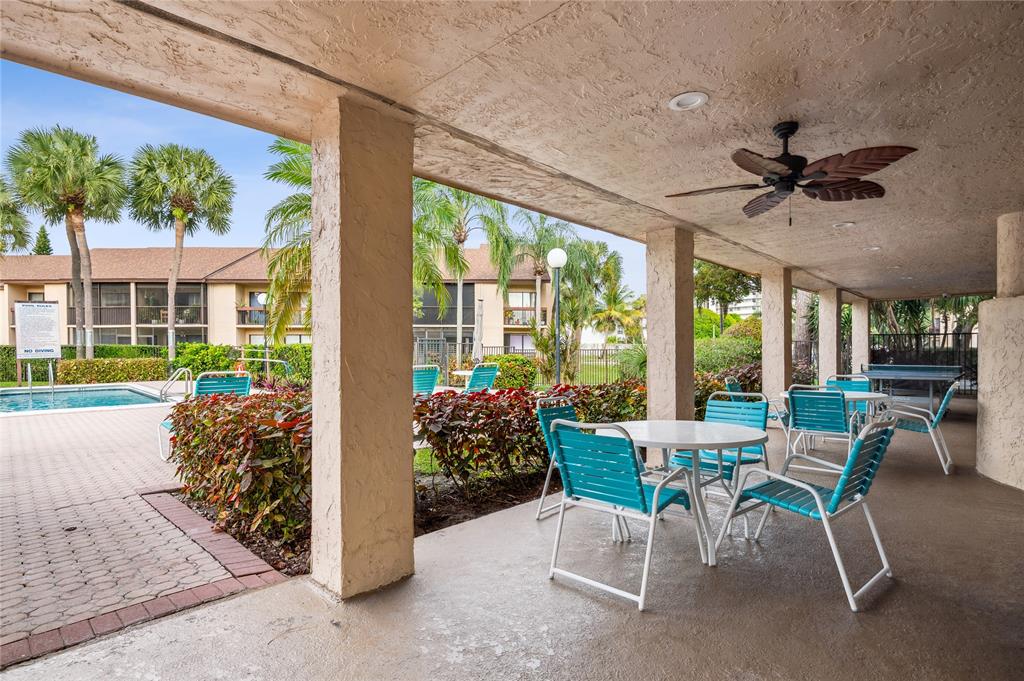 2249 Southwest 15th Street, Unit 185 Deerfield Beach, FL 33442 - Photo 19 of 31 a view of a porch with furniture and a yard