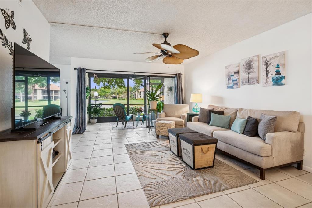 2249 Southwest 15th Street, Unit 185 Deerfield Beach, FL 33442 - Photo 5 of 31 a living room with furniture and a flat screen tv