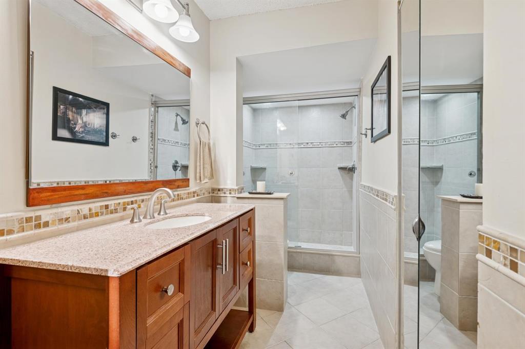 2249 Southwest 15th Street, Unit 185 Deerfield Beach, FL 33442 - Photo 9 of 31 a bathroom with a sink a mirror and a shower