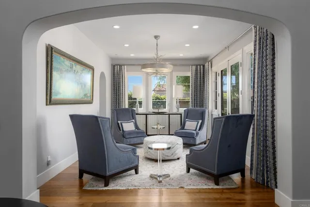 a view of a dining room with furniture window and wooden floor