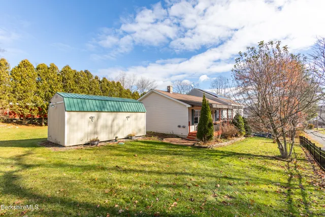 a view of a balcony with chairs