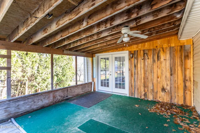 a view of porch with wooden floor