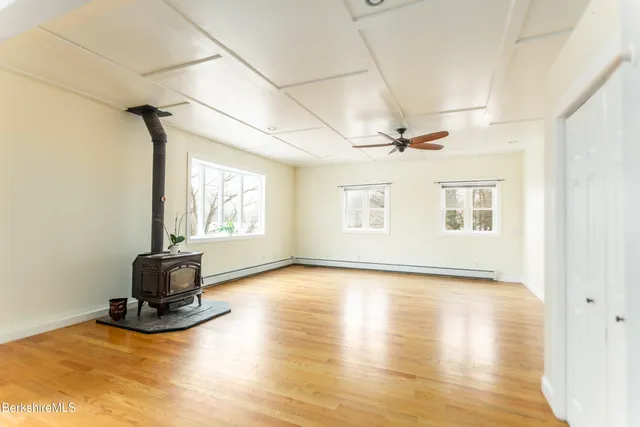 a view of a room with gym equipment and a window