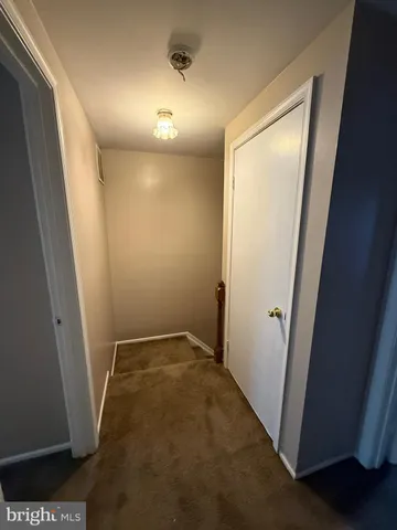 a view of hallway with a mirror