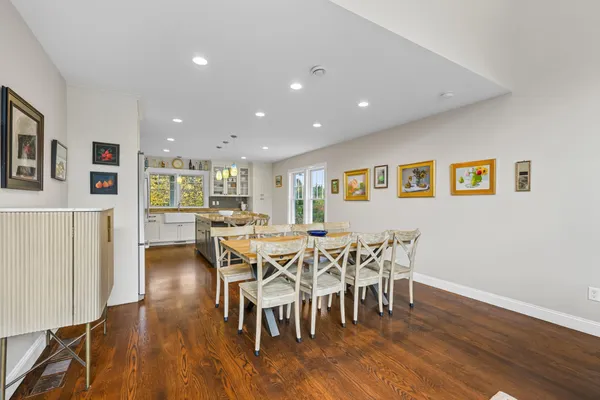 a kitchen with stainless steel appliances granite countertop a stove a refrigerator and a microwave