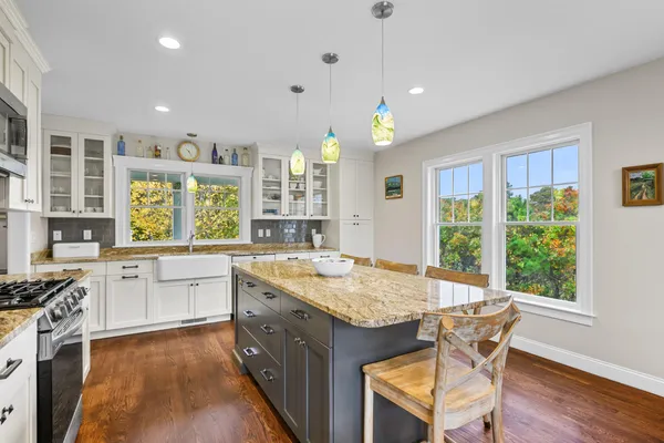 a bedroom with furniture and a wooden floor