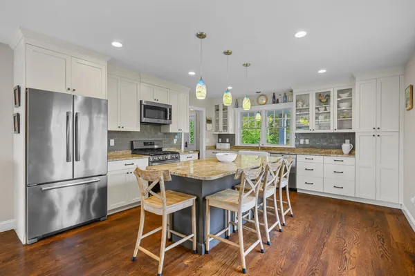 a bedroom with a large bed and a couch