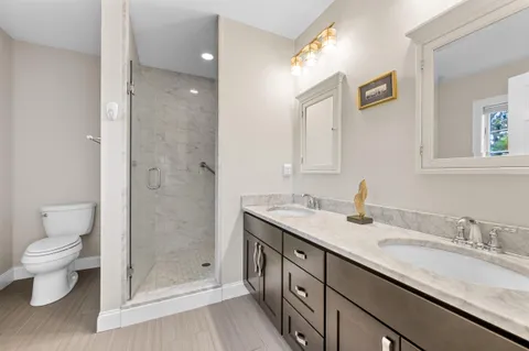 a view of an entryway with wooden floor and windows