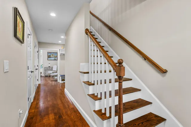 a bedroom with a bed and a lamp