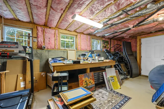 a view of a deck with a table and chairs next to a yard