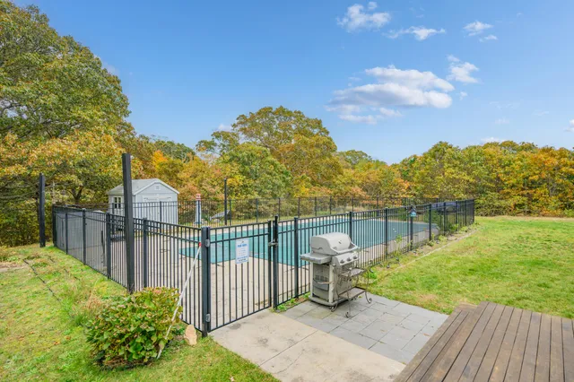 a view of backyard with green space