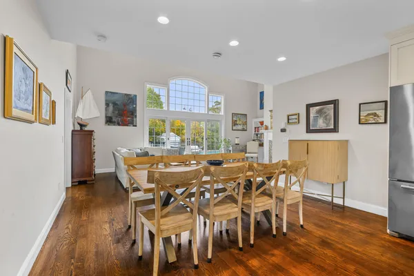 a view of a dining room with furniture and wooden floor