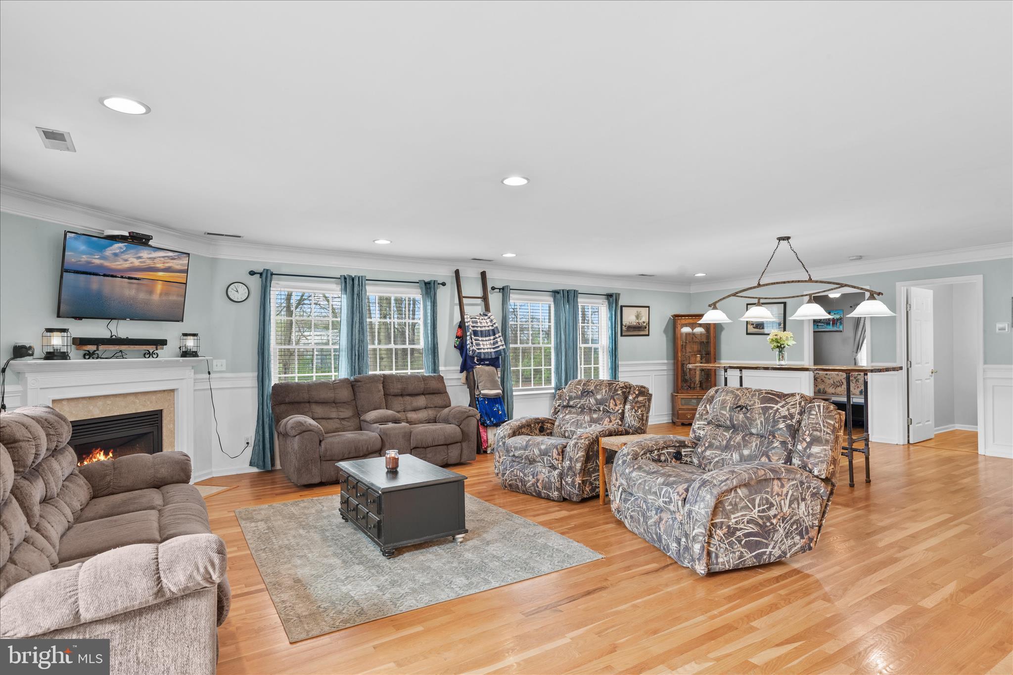 12647 Old Stage Road Bishopville, MD 21813 - Photo 50 of 84 a living room with furniture fireplace and a flat screen tv