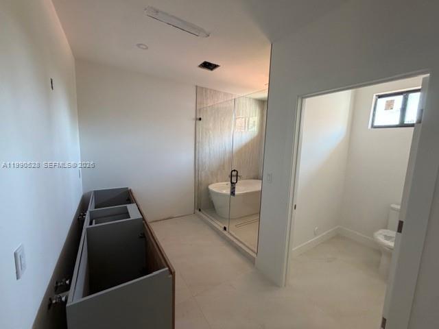 2800 Southwest 38th Court Miami, FL 33134 - Photo 8 of 19 a bathroom with a sink and toilet