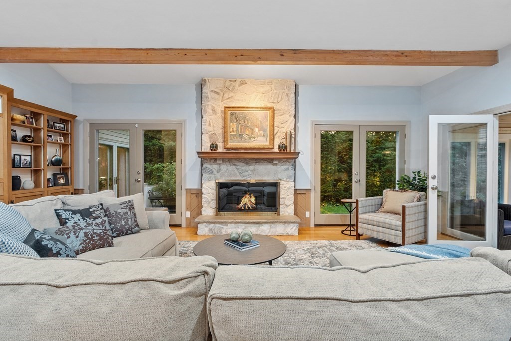 110 Mattison Drive Concord, MA 01742 - Photo 12 of 41 a living room with furniture and a fireplace