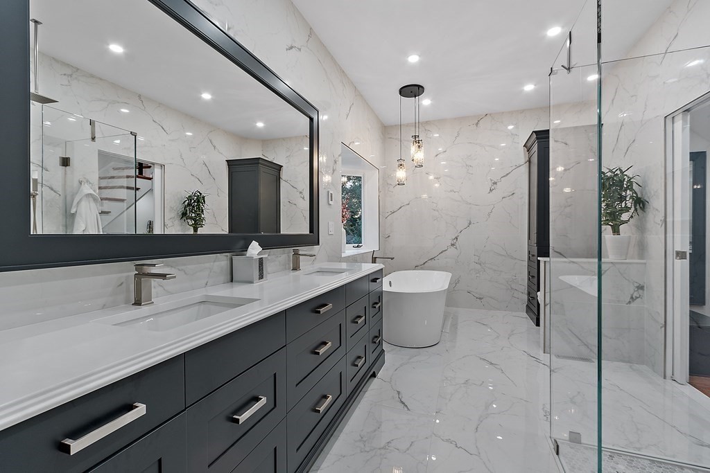 110 Mattison Drive Concord, MA 01742 - Photo 15 of 41 a bathroom with a double vanity sink toilet and a mirror