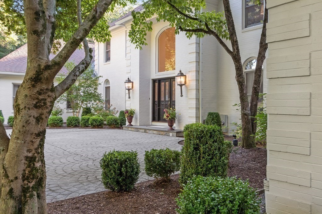110 Mattison Drive Concord, MA 01742 - Photo 2 of 41 a house with a tree in front of it