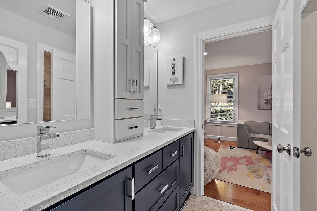110 Mattison Drive Concord, MA 01742 - Photo 22 of 41 a bathroom with a sink double vanity and a mirror