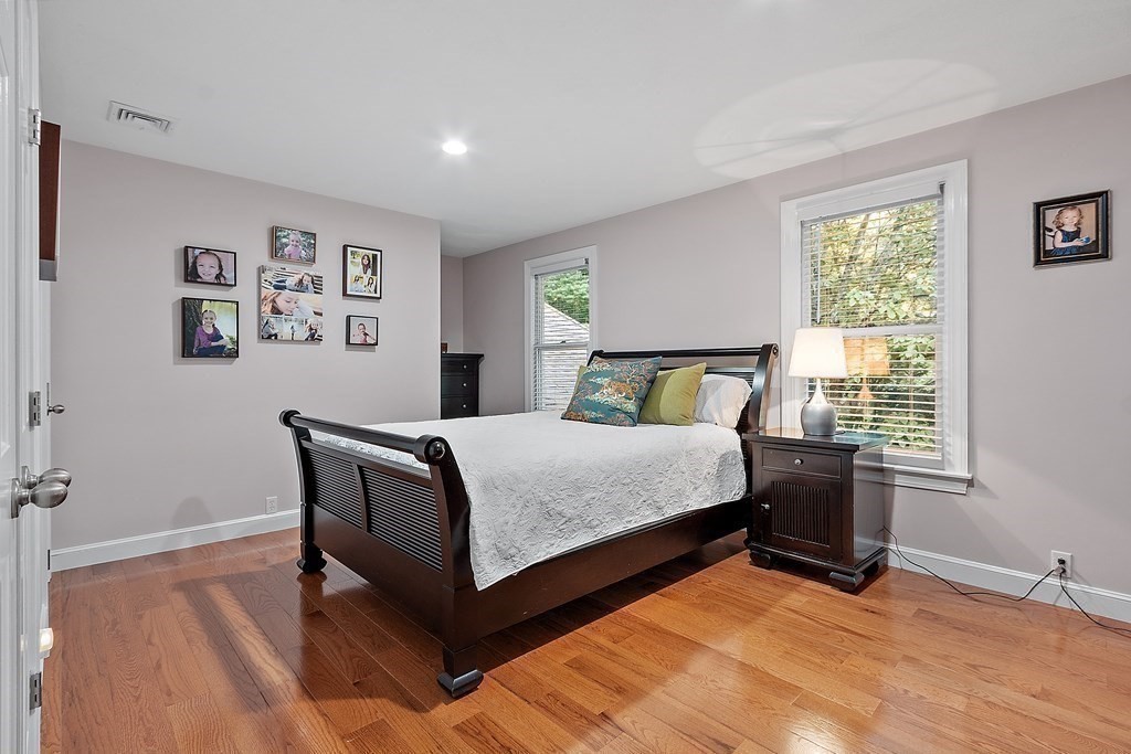 110 Mattison Drive Concord, MA 01742 - Photo 24 of 41 a bedroom with a bed table and window
