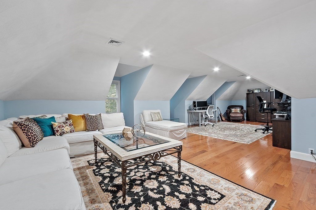 110 Mattison Drive Concord, MA 01742 - Photo 27 of 41 a living room with furniture and a table
