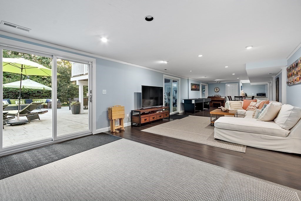 110 Mattison Drive Concord, MA 01742 - Photo 29 of 41 a living room with furniture and a flat screen tv