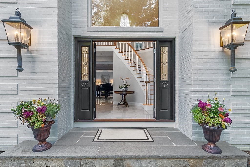 110 Mattison Drive Concord, MA 01742 - Photo 3 of 41 a lobby with furniture and flowers