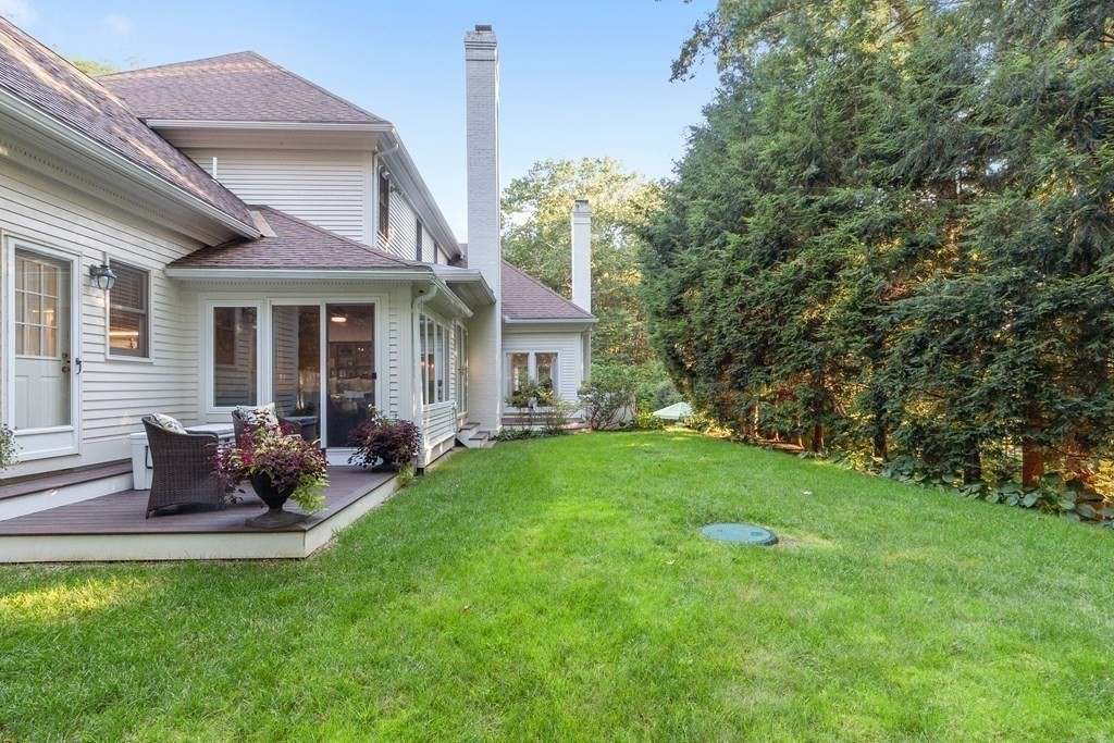 110 Mattison Drive Concord, MA 01742 - Photo 34 of 41 a backyard of a house with table and chairs