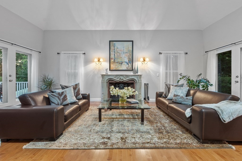 110 Mattison Drive Concord, MA 01742 - Photo 6 of 41 a living room with furniture and a fireplace