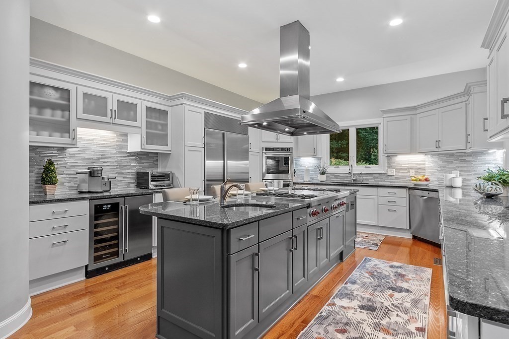 110 Mattison Drive Concord, MA 01742 - Photo 8 of 41 a kitchen with stainless steel appliances granite countertop a stove and a sink