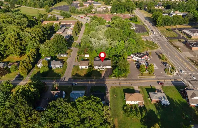 an aerial view of residential houses with outdoor space
