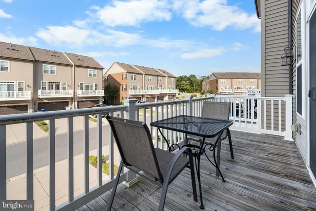 a view of a balcony with furniture