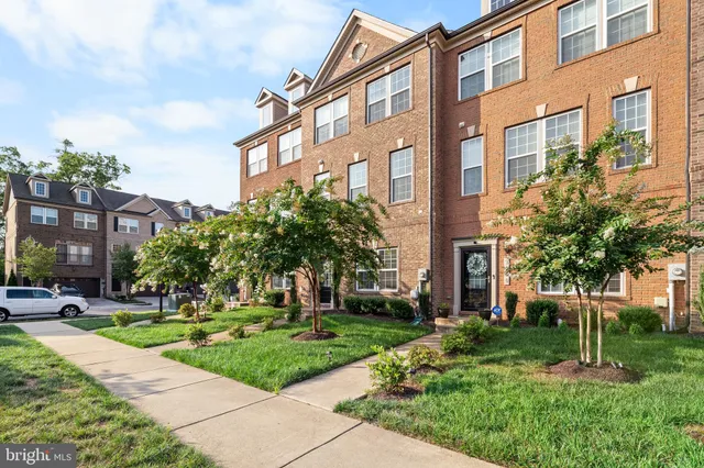 a view of a building with a yard