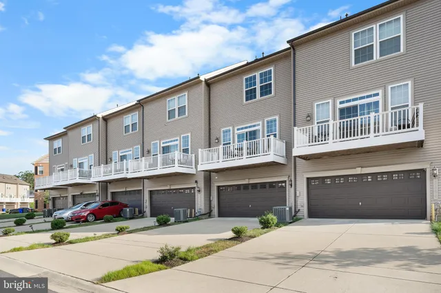 a front view of a building with many windows
