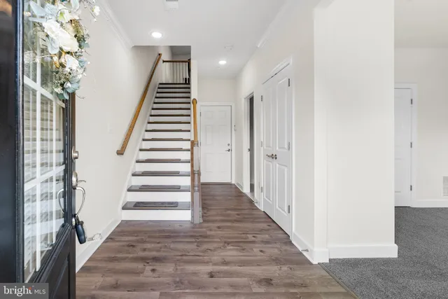 a view of entryway with wooden floor