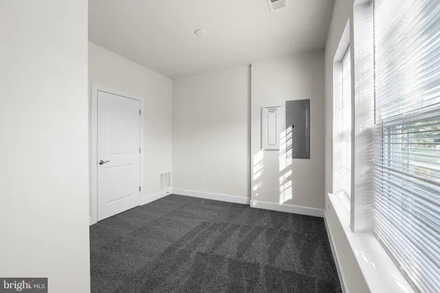 a view of an empty room with a window