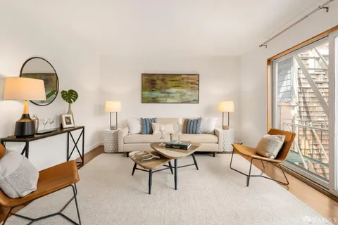 a living room with furniture and a window